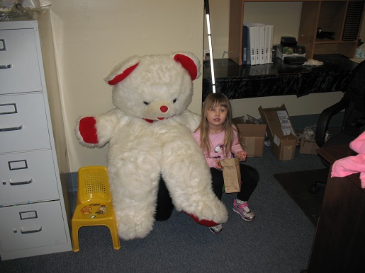 A little girl and the Christmas Teddy Bear